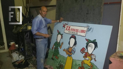 Rubito González pintando cartel - Edición XX Feria del Libro  